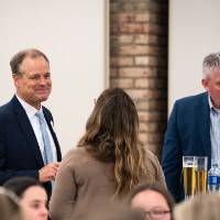 Group of people chatting and smiling